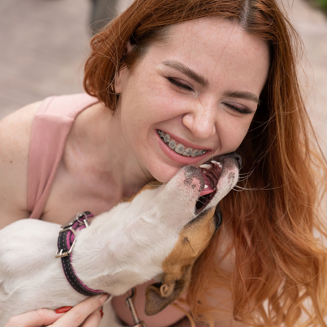 dog licking owner